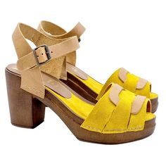 Comfortable clogs perfect for everyday wear. Upper in yellow suede Brown base with wood effect Open toe 8.5 cm heel and 3.5 cm plateau Stable and comfortable made entirely in ITALY. Craftsmanship. BEFORE PURCHASING DO NOT FORGET TO CHECK THE SIZE! Yellow Block Heels With Buckle Closure, Summer Suede Clogs With Buckle Closure, Yellow Open Heel Shoes With Heel Loop, Suede Clogs With Heel Loop, Yellow Sandals With Low Heel And Heel Strap, Yellow Sandals With Heel Strap And Low Heel, Yellow Sandals With Wooden Heel For Spring, Yellow Platform Sandals With Open Heel, Yellow Suede Closed Toe Heels