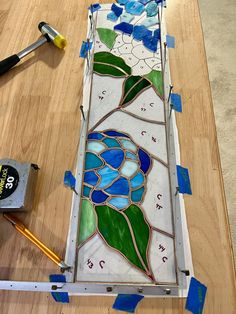 a stained glass window being worked on