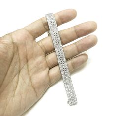 Retro / vintage inspired elegantly slim platinum 950 bracelet. Radiant cut white round natural diamonds 10.63 ct. Diamonds in G-H Color Clarity VS. Length: 18 cm Width: 1.1 cm Weight: 37.6 g [shortcode] [video] [/video] [/shortcode] White Diamond Bracelet In Platinum Luxury Style, White Platinum Diamond Bracelet With Accents, White Diamond Cut Platinum Diamond Bracelet, White Diamond Cut Platinum Bracelet, White Platinum Diamond Bracelet For Formal Occasions, White Platinum Diamond Cut Bracelet, Formal White Platinum Diamond Bracelet, White Diamond Bracelet With Pave Setting For Formal, Formal White Diamond Bracelet With Pave Setting