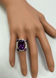 16.85 Carats Natural Amethyst and Diamond 14K Solid Yellow Gold Ring Suggested Replacement Value: $6,700.00 Total Natural Oval Shaped Amethyst Weights: Approx. 16.00 Carats Natural Round Diamonds Weight: Approx. 0.85 Carats (color G-H / Clarity SI1-SI2) Ring total weight: Approx. 12.00 grams Disclaimer: all weights, measurements and colors are approximate and may vary slightly from the listed dimensions or as seen in the image. All pictures are magnified to show the smallest of details. Please, Luxury Multi-stone Amethyst Wedding Ring, Luxury Multi-stone Amethyst Ring For Weddings, Luxury White Gold Amethyst Ring With Gemstone Accents, Luxury Multi-stone Amethyst Ring For Formal Occasions, Luxury Purple Rings For Party, Luxury Purple Party Rings, Luxury Amethyst Gemstones With Accent Stones, Luxury Amethyst Gemstones With Prong Setting, Luxury Multi-stone Amethyst Jewelry