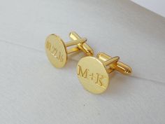 "Finish your shirt sleeves in style using these personalized monogram cuff links that feature 925 sterling silver with 18k gold Plated. The classic circle cuff links are engraved in your choice of initials with an elegant font. You can have it done in solid sterling silver,18k gold plating,white gold plating or rose gold plating. Your purchase will arrive inside a lovely gift box ready to give.Please let me know if you want to include a handwriting message with your gift. Why buy from us? *Quali Personalized Classic Cufflinks For Anniversary, Classic Personalized Adjustable Cufflinks, Father's Day Gold Engraved Cufflinks, Father's Day Engraved Gold Cufflinks, Engraved Cufflinks For Anniversary, Classic Personalized Cufflinks For Wedding Gift, Classic Cufflinks With Initials For Wedding Gift, Classic Round Personalized Cufflinks, Gold Cufflinks With Initials For Gift