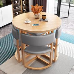 a round table with four chairs around it