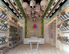 the interior of a flower shop with hanging flowers