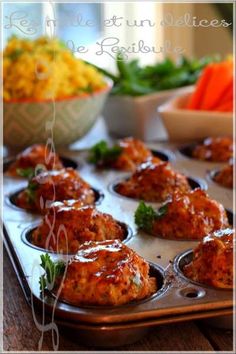 some food is in a muffin tin on a table