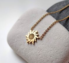 This amazing dainty sun necklace is such a great piece of every jewelry collection. The sunburst charm just brings good luck and happiness, good karma. This small gold sun pendant can be layered with other celestial necklace or worn on it's own. Pendant Size: 1.2 cm x 1.2 cm All my jewellery is lead and nickle free. I am attaching the minimalist sun charms on gold chain, which I cut to size to create something pretty just for you.   ✽ ENVIRONMENTAL FRIENDLY PACKAGE I was always feeling bad for creating more waste on this planet so I try to be environmental friendly everywhere where possible. All my wrapping material is biodegradable and recyclable :) My jewelry comes on A6 designed paper in a biodegradable cellophane bag which can either go to compost or landfills as it will disappear in a Celestial Sun Design Necklaces For Gifts, Celestial Sun Design Necklaces As A Gift, Celestial Style Necklaces With Sun Design For Gifts, Celestial Sun Design Necklaces As Gifts, Sun-shaped Jewelry With Sun And Moon Design For Gift, Minimalist Sun And Moon Necklace As Gift, Sun Design Pendant Necklace Gift, Adjustable Sun-shaped Jewelry For Gifts, Minimalist Sun And Moon Design Necklace As Gift