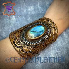 Hand Tooled Leather Cuff Bracelet With Rainbow Labradorite & | Etsy Unique Handmade Labradorite Cuff Bracelet, Bohemian Gold Bracelet With Patina, Gold Bohemian Bracelet With Patina, Bohemian Brown Cuff Bracelet With Patina, Bohemian Adjustable Cuff Bracelet With Antique Finish, Adjustable Bohemian Cuff Bracelet With Antique Finish, Handmade Gold Leather Bangle Bracelet, Unique Handmade Gold Leather Bracelet, Gold Bohemian Leather Bracelet Gift