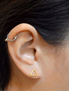 Small open triangle studs - a light and airy staple for the edgy minimalist. Posts have been soldered onto the corner so they stay pointing upward. Tumble polished for hours to achieve a satin finish. • tarnish resistant• rhodium silver filled/22k gold filled, hypoallergenic sterling silver posts • 9x8mm (just under 3/8" x 5/16")• handmade in Toronto, Canada Edgy Minimalist, Triangle Studs, Triangle Earrings, Toronto Canada, 22k Gold, Satin Finish, Gold Filled, Toronto, Satin