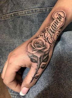 a person with a rose tattoo on their arm