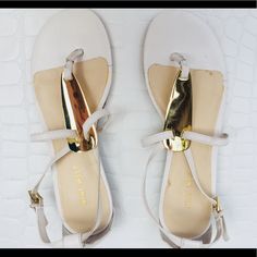 Nine West “Wesley” Thing Sandals With Gold Accent, Never Worn Like New Condition. Elegant Round Toe Sandals For Day Out, Cream Toe Post Sandals For Spring, Chic Cream Toe Post Sandals, Elegant Flat Heel Sandals For Day Out, Spring Cream Toe Post Sandals, Chic Flat T-strap Sandals With Heel Strap, White Chic T-strap Sandals With Closed Toe, Chic Flat T-strap Sandals For Spring, Chic White T-strap Sandals With Round Toe