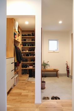 an empty walk in closet with shoes on the floor