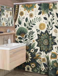 a bathroom with a floral shower curtain next to a white sink and wooden counter top