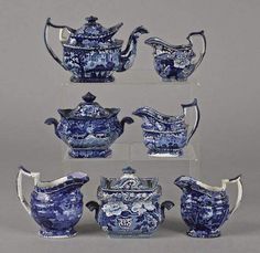 a group of blue and white porcelain items