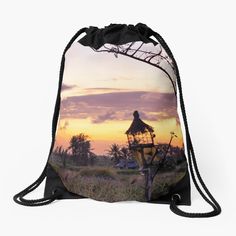 a drawsack bag with a sunset in the background