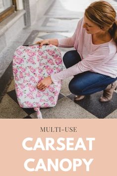 a woman kneeling down next to a pink and white blanket with the words multi use car seat canopy