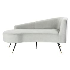 a white couch with black legs and a curved back