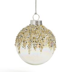 a white and gold christmas ornament hanging from a silver chain on a white background