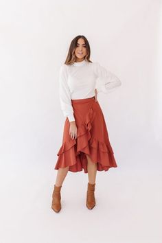 The Agnessa Ruffle Skirt features side button details and ruffle bottom detail. It is high waited and a true wrap skirt. It runs small, size up. 90% Cotton 10% Linen Model is 5’8″ and wearing a Small.  Paired it with our Ronnie Top  Elastic Waist- Expands up to 2 inches. Small: Waist 24″ Length 33″ Medium: Waist 26″ Length 34″ Large: Waist 28″ Length 34: High Waisted Ruffle Skirt, Ruffle Wrap Skirt Outfit, Ruffled Skirt Outfit, High Low Skirt Outfit, Tulip Skirts, Wrap Skirt Outfit, Ruffle Skirt Outfit, Black Wrap Skirt, Ruffle Wrap Skirt