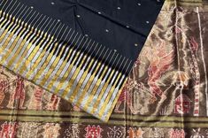 exclusive black sambalpuri silk saree from the weavers of Odisha. This handmade Odisha silk has an exclusive kathiphera border design in gold and silver tissue silk. The anchal is handweaved with tissue silk with intricate sambalpuri ikkat motifs, The saree comes with blouse piece Black Paithani Silk Handloom Dupatta, Black Handloom Dupatta For Festivals, Black Handloom Paithani Silk Dupatta, Handloom Black Dupatta For Festivals, Black Silk Handloom Saree, Black Silk Handloom Dupatta, Black Paithani Silk Saree With Traditional Patterns, Black Paithani Silk Dupatta With Motifs, Black Paithani Silk Dupatta With Traditional Patterns