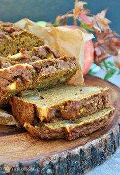 sliced loaf of bread sitting on top of a wooden cutting board