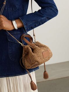 ANYA HINDMARCH Small leather-trimmed raffia tote | NET-A-PORTER Beige Bucket Bag With Intrecciato Weave For Vacation, Summer Beach Bucket Bag With Intrecciato Weave, Natural Straw Bag, Natural Woven Leather Straw Bag For Errands, Natural Straw Bag With Woven Leather For Errands, Summer Brown Intrecciato Weave Bucket Bag, Summer Brown Bucket Bag With Intrecciato Weave, Summer Bucket Bag With Intrecciato Weave, Beach Bucket Bag With Intrecciato Weave