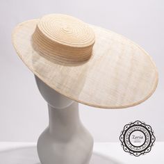 Flat top modeling sinamay millinery blank fascinator bases (not a regular hat) are made from the combination of Crushable Wide Hemp Braid sewn crown and flat stiffened sinamay oval shape brim.  It is great for creating fascinators or millinery hats. This sinamay frame is for hat making. Please note, this is a fascinator base with 2in deep shallow crown, it come with elastic to hold it on your head.  Comb or headband sold separately.   THIS IS NOT A READY-TO-WEAR item, you may need to add hat-fitting accessories like a comb or elastic for proper wearing on your head.  Accessories for combs or elastic bands are sold separately. Material: 100% Hemp / Sinamay Straw Crown Top: 6 inch Crown Deep: 2 inch Brim size: Long side 7 1/2 inch, Short Side 2 inch Made in Philippines Flat Fascinator Hat, Hemp Hat, Guest Ideas, Sinamay Fabric, Flat Top Hat, Derby Outfits, Blank Hats, White Veils, Sinamay Hats