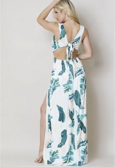 This sexy beach maxi dress features a plunge neckline,sleeveless, floral print all over, open back, bow tie design, splits all the way up perfect with a bikini or swimsuit for a walk on the beach measures about 50 inches long 92% Polyester 8% spandex Small Size 4-6 Backless Maxi Dress For Brunch During Beach Season, V-neck Beach Dress With Tie Back, Tropical Sleeveless Beach Dress For Brunch, Sleeveless Tropical Beach Dress For Brunch, Beachy Vacation Maxi Dress With Tropical Print, Beachy Maxi Dress With Tropical Print For Vacation, Tropical Maxi Dress For Vacation Brunch, Spring Beach Maxi Dress With Cutout Back, Backless Maxi Dress For Summer Beach Parties