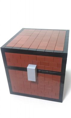 a lego box with a white door on the top and red bricks on the bottom