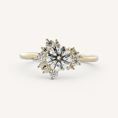 a white diamond ring with yellow gold accents