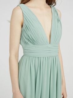 the back of a woman's green dress