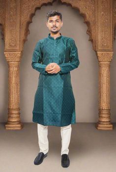 Elevate your traditional style with our Rama Silk Kurta Pajama Set. The self-embroidered design exudes luxury while the Cream color Pajama creates a tasteful contrast. Complete with similar buttons, this set is perfect for special occasions. Embrace the elegance of Indian Wear with this exclusive Mens Churidaar. Product details: Product: Men's Kurta Pajama Fabric type: Cotton Silk Ready to Wear: Yes Design Work: Self Embroidery Sleeve Length: Long Sleeves Fit type: Regular/ Comfort, Length: Knee length Kurta Pocket : Yes Country of Origin: India Wash Care: Dry Clean Festive Kurta With Bandhani Print For Traditional Ceremonies, Festive Bandhani Print Kurta For Traditional Ceremonies, Festive Bandhani Print Kurta For Ceremonies, Bandhani Print Kurta For Diwali, Bandhani Print Kurta For Diwali Ceremonies, Green Sherwani With Traditional Patterns For Eid, Green Sherwani For Puja And Eid, Green Sherwani For Eid, Green Dabka Kurta