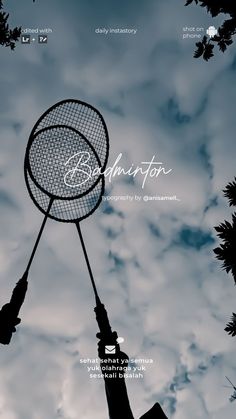 the silhouette of a person holding a badminton racket in front of a cloudy sky