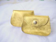 A gold purse to carry valuables!  It has enough room for cash, a few cards, and a lipstick.  There is a separate slot for the driver's license. The bright color may also be easier to find in a purse or pocket.  The gold finish on this item is vibrant and will get attention.   Dimensions are 4 ¾" X 3 ¼" and 1" deep. Thank you for viewing my items! Gold Rectangular Bag With Interior Card Slots, Rectangular Gold Bag With Interior Card Slots, Compact Gold Coin Purse With Card Slots, Gold Wallet With Coin Pocket For Everyday Use, Gold Coin Purse With Coin Pocket As A Gift, Gold Coin Purse For Daily Use, Gold Coin Purse As Gift, Gold Rectangular Coin Purse With Card Slots, Compact Gold Wallet For Everyday Use