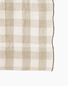 a beige and white checkered table cloth