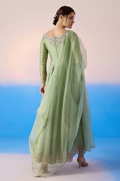 Sage green padded anarkali with thread embroidered floral blossom patterns, embellished by sequins and crystals. Comes with dupatta. - Aza Fashions Anarkali Organza Churidar With Long Sleeves, Tissue Silk Anarkali Set With Sheer Dupatta, Anarkali Set With Long Sleeves In Organza, Green Art Silk Dress With Sheer Dupatta, Luxury Light Green Anarkali Dupatta, Green Tissue Silk Anarkali Set With Sheer Dupatta, Green Anarkali Set With Sheer Dupatta In Tissue Silk, Green Chanderi Gown For Reception, Organza Anarkali Set With Long Sleeves