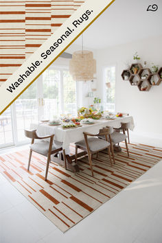 a dining room table is set with plates and bowls