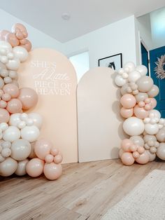 there are balloons that spell out the word love in front of an arch and door