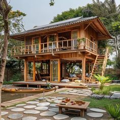 a wooden house sitting on top of a lush green field