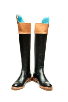 Milenika's handmade black women's tall riding boots, equestrian-inspired boots. These boots feature soft black leather, high Spanish-cut topline, almond toe, detailed with turquoise blue the pull up stripe, brown panel and handcrafted leather sole and zip fastening along back for easy to put on/off. We like them styled with skinny jeans, sleek leggings or an oversized sweater dress. Full leather outer, interior and sole. DETAILS: Full leather upper, lining and sole Black and brown leather Turquo Fitted Black Knee-high Riding Boots, Black Knee-high Riding Boots For Fall, Black Knee-high Moto Boots For Riding, Black Knee-high Moto Riding Boots, Black Knee-high Boots With Round Toe For Riding, Black Wide Calf Knee-high Boots For Riding, Black Flat Boots, Sweater Dress Oversized, Boots Knee High