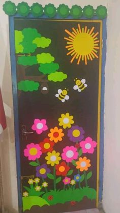 the door is decorated with flowers and bees