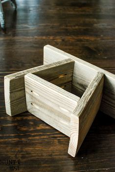 a wooden box sitting on top of a wooden table