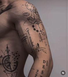 the back of a man's body with tattoos on his arm and chest,