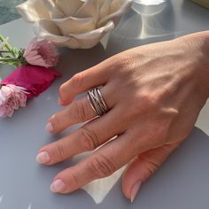 Discover timeless elegance with our Chunky Silver Thumb Ring. Crafted for the modern woman, this multi-layered signet ring is the ultimate expression of unique style. It's not just jewelry; it's a statement.  A perfect Christmas gift for her, this open adjustable ring adds a touch of sophistication to any ensemble.  Embrace individuality and shop now to give her a gift she'll treasure forever.  Order now and make a fashion statement that reflects your individuality! ----------------------------------------------------🧡 SAME DAY SHIPPING  ----------------------------------------------------🧡 SIZE: Adjustable ADJUSTABLE  size range: UK M/US 6 - UK S/US 10 MATERIAL: 925 Sterling Silver Plated Bronze HYPOALLERGENIC %100 NICKEL AND LEAD FREE TARNISH FREE WATERPROOF --------------------------- Minimalist Stacked Rings For Anniversary, Minimalist Stacked Anniversary Rings, Elegant Stacked Rings As A Gift, Elegant Stackable Rings As Gift, Elegant Gift Stackable Rings, Stacked Rings For Anniversary, White Gold Stackable Wide Band Ring Gift, Stackable White Gold Wide Band Ring Gift, Modern Double Band Ring As Gift