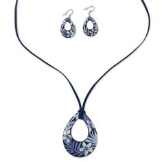 a necklace and earring set with an oval shaped pendant on a blue cord string