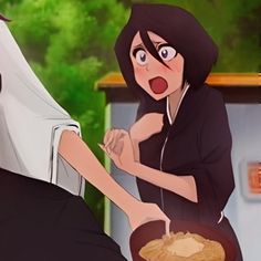 an animated image of a woman being served food from a pan to another woman's head