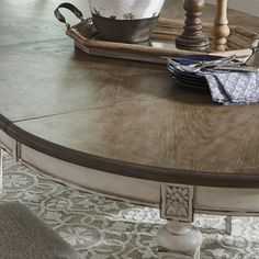 a table with some plates on it and a potted plant in the centerpiece