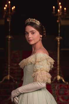 a woman in a white dress and tiara