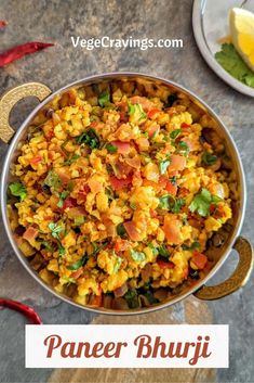 a bowl filled with rice and vegetables on top of a table