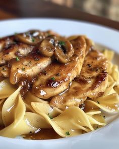 pasta with mushrooms and sauce in a white bowl