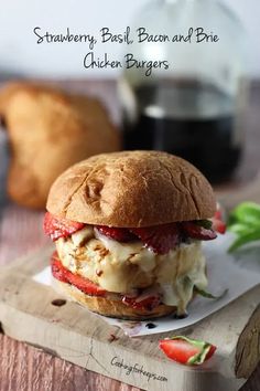 a sandwich with meat and cheese on a cutting board