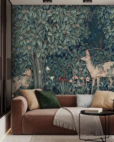 a living room filled with furniture and wallpaper covered in animal themed murals on the walls